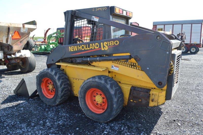 '03 NH LS180 skid loader w/ 4,000 hrs, 2 speed, sells w/ new 72" material bucket