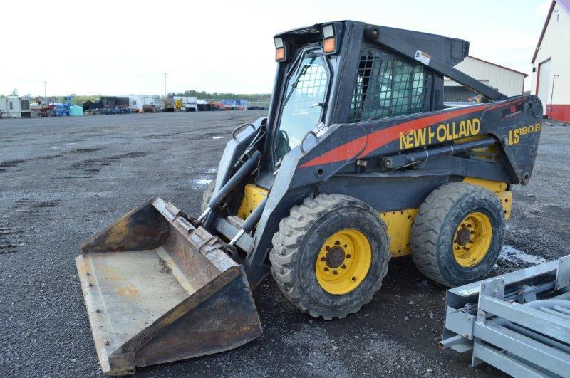 NH LS185B skid loader w/8,483 hrs, quick attach, 77" bucket, Hyd aux, 12-16.5 tires