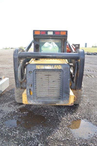 NH LS185B skid loader w/8,483 hrs, quick attach, 77" bucket, Hyd aux, 12-16.5 tires