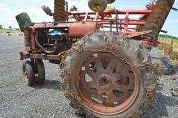 Farmall F20 tractor w/ tire chains, draw bar, tricycle tire (needs tune up job)