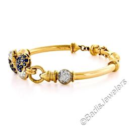 18kt Yellow Gold 1.58 ctw Diamond and Sapphire Dual Heart Curved Tube Link Brace