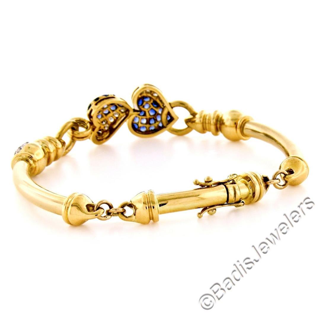 18kt Yellow Gold 1.58 ctw Diamond and Sapphire Dual Heart Curved Tube Link Brace