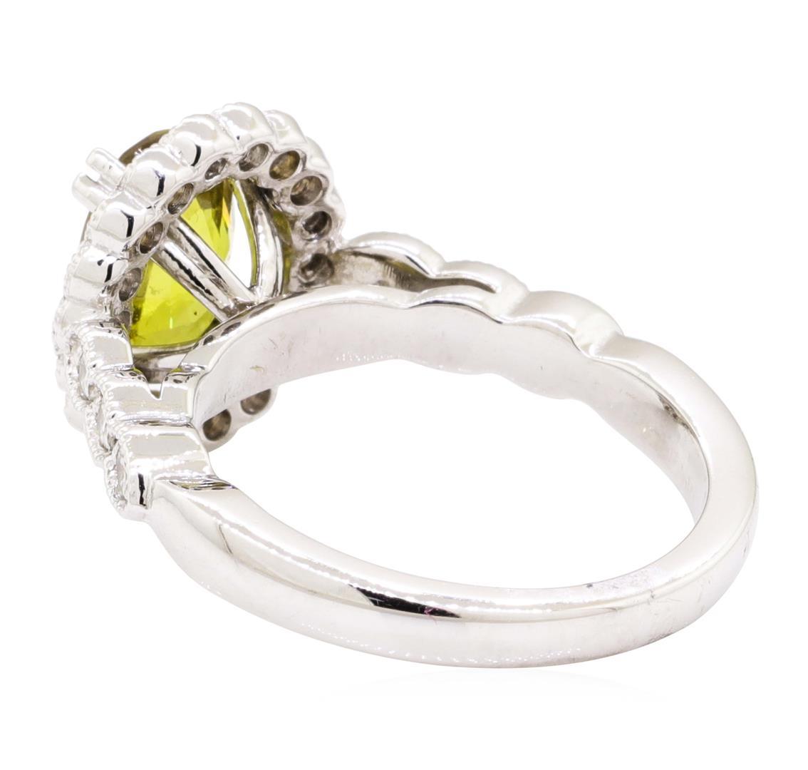 3.17 ctw Oval Mixed Yellow Sapphire And Round Brilliant Cut Diamond Ring - 14KT