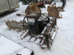 1132- Lowe trencher skid loader attachment