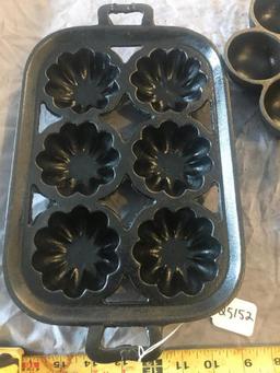 1 corn mold pan, 1 egg poacher, both cast iron, selling one money