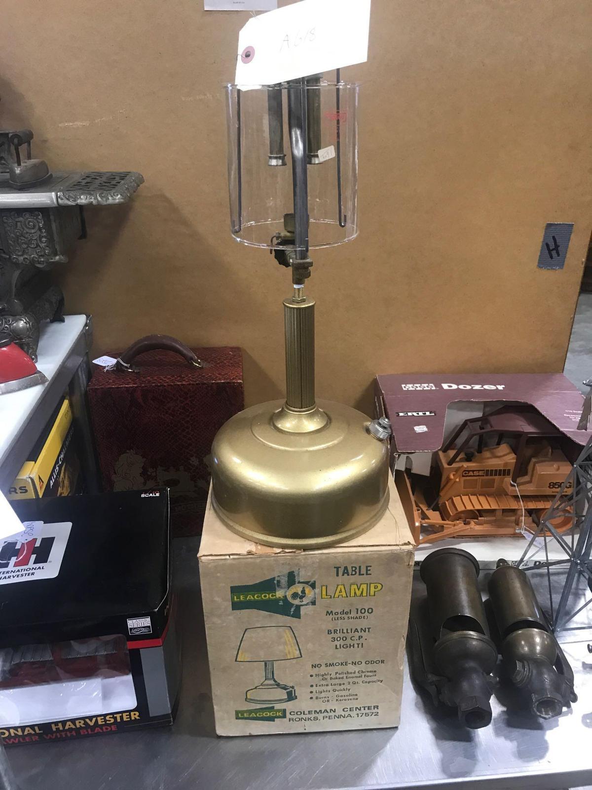 NOS Coleman model 100 table lamp with original invoice.