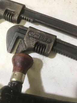 Cowbells, Millers Falls Drill, Wooden Plane, and 3 wrenches including one embossed with Ford