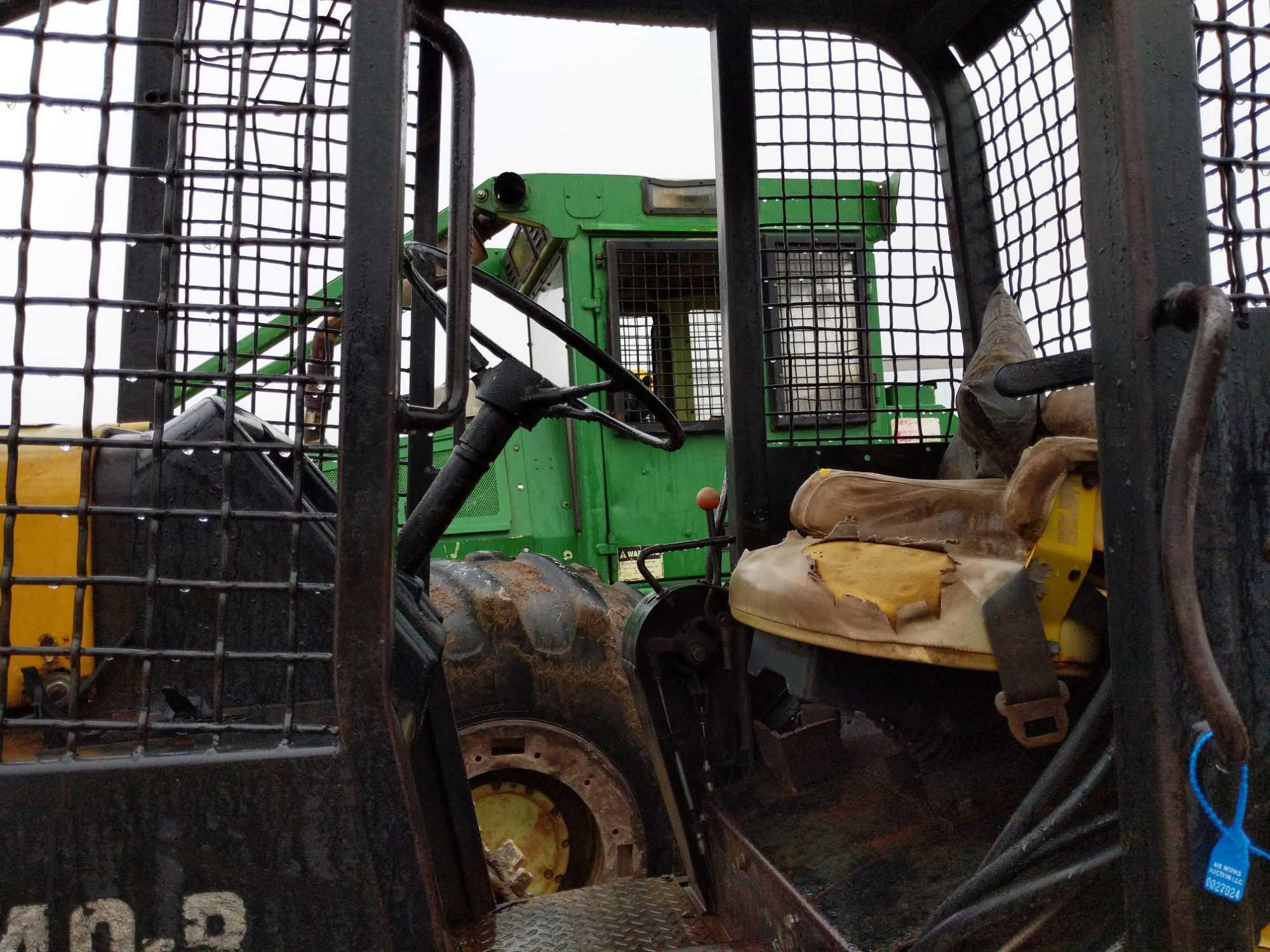 27024- John Deere JD540-B Skidder, showing 9695 hours