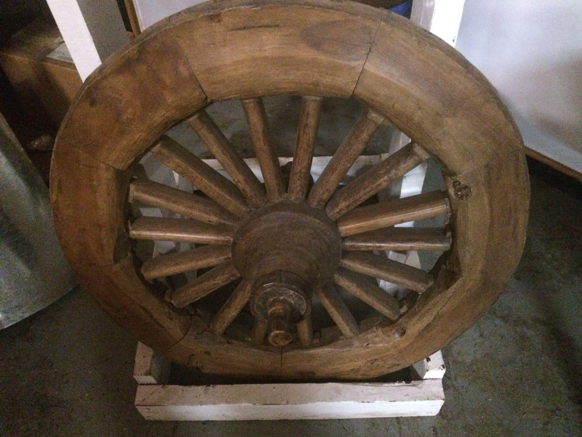 Wooden chariot or wagon wheel With wooden stand