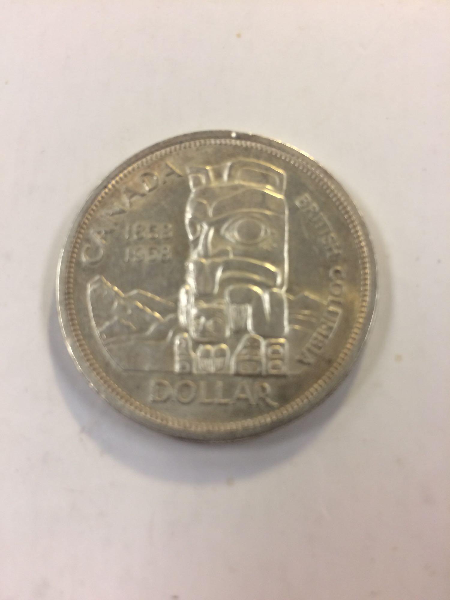 1858 1958 Canada one dollar coin