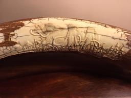 SINGLE MAMMOTH TUSK -24"LONGx10.5" CIRCUMFRANCE W/CARVED SCENE OF 3 MAMMOTHS CARVED IN IT (US RES)