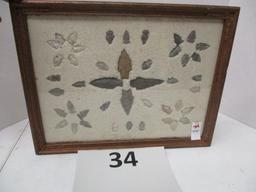 44 arrowheads mounted in frame