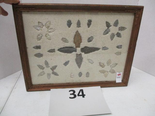 44 arrowheads mounted in frame