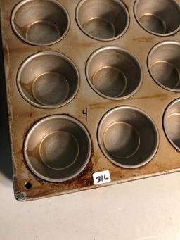 Large group of commercial muffin pans