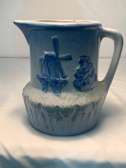 BLUE AND WHITE STONEWARE DUTCH WINDMILL AND TULIP PATTERN MILK PITCHER