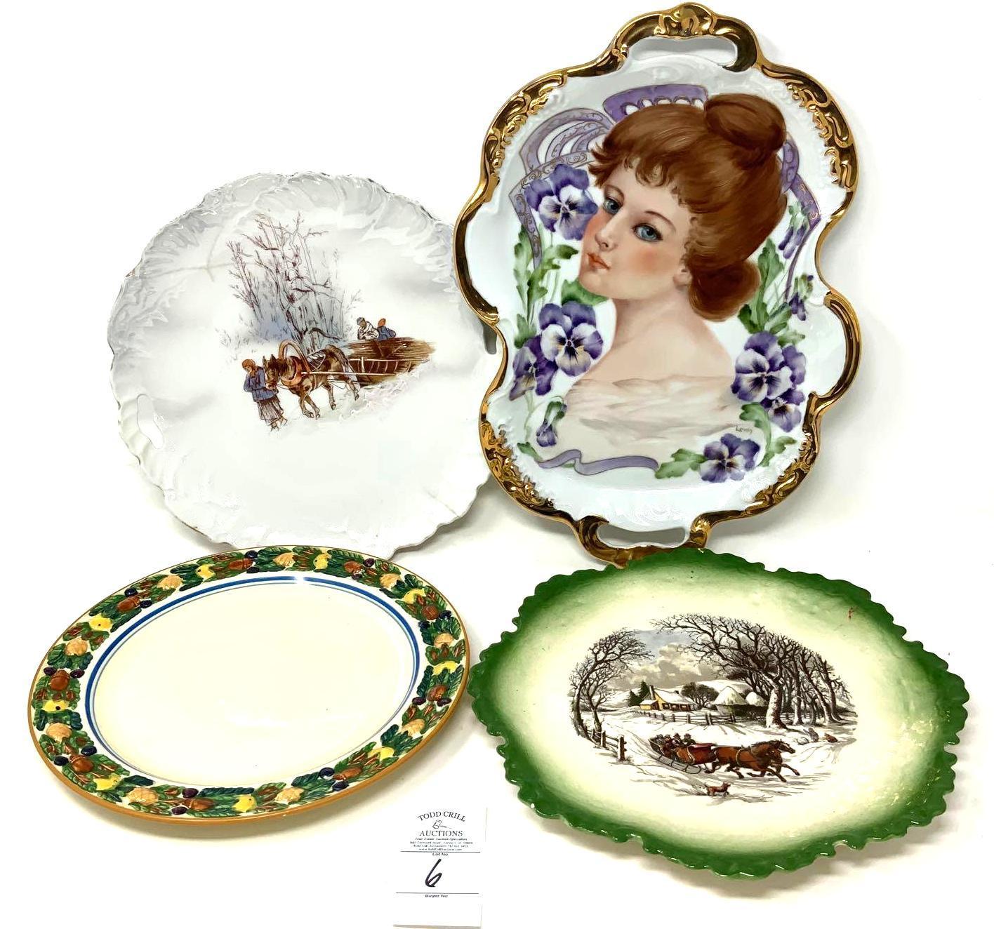 Four vintage decorated plates