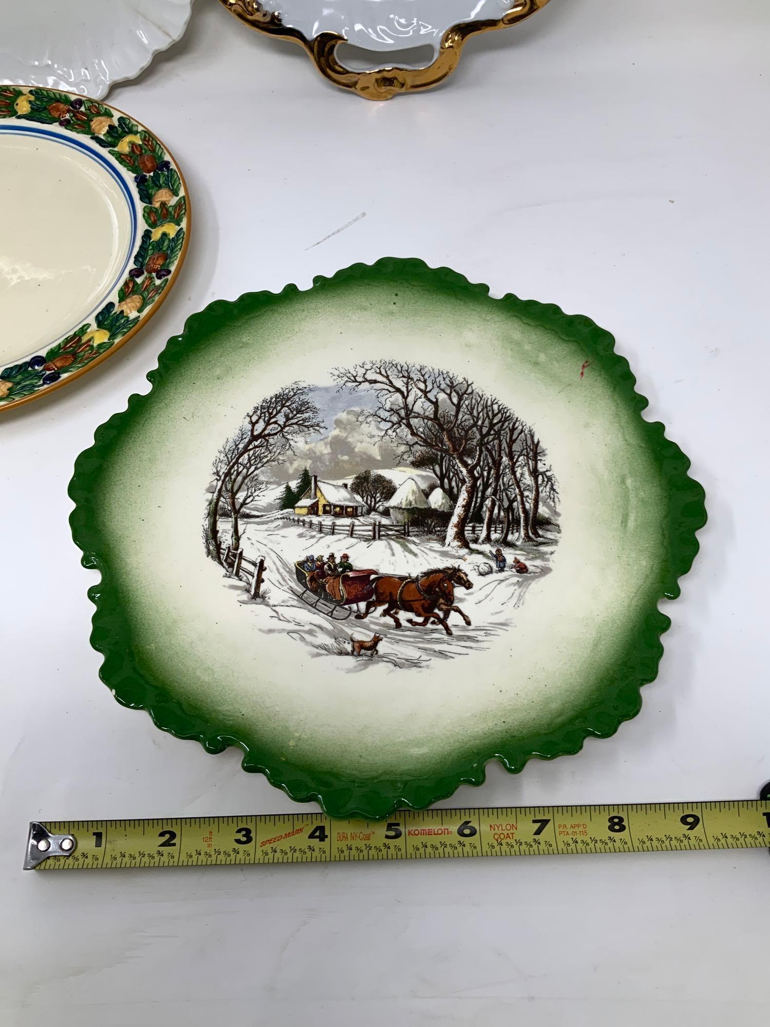 Four vintage decorated plates