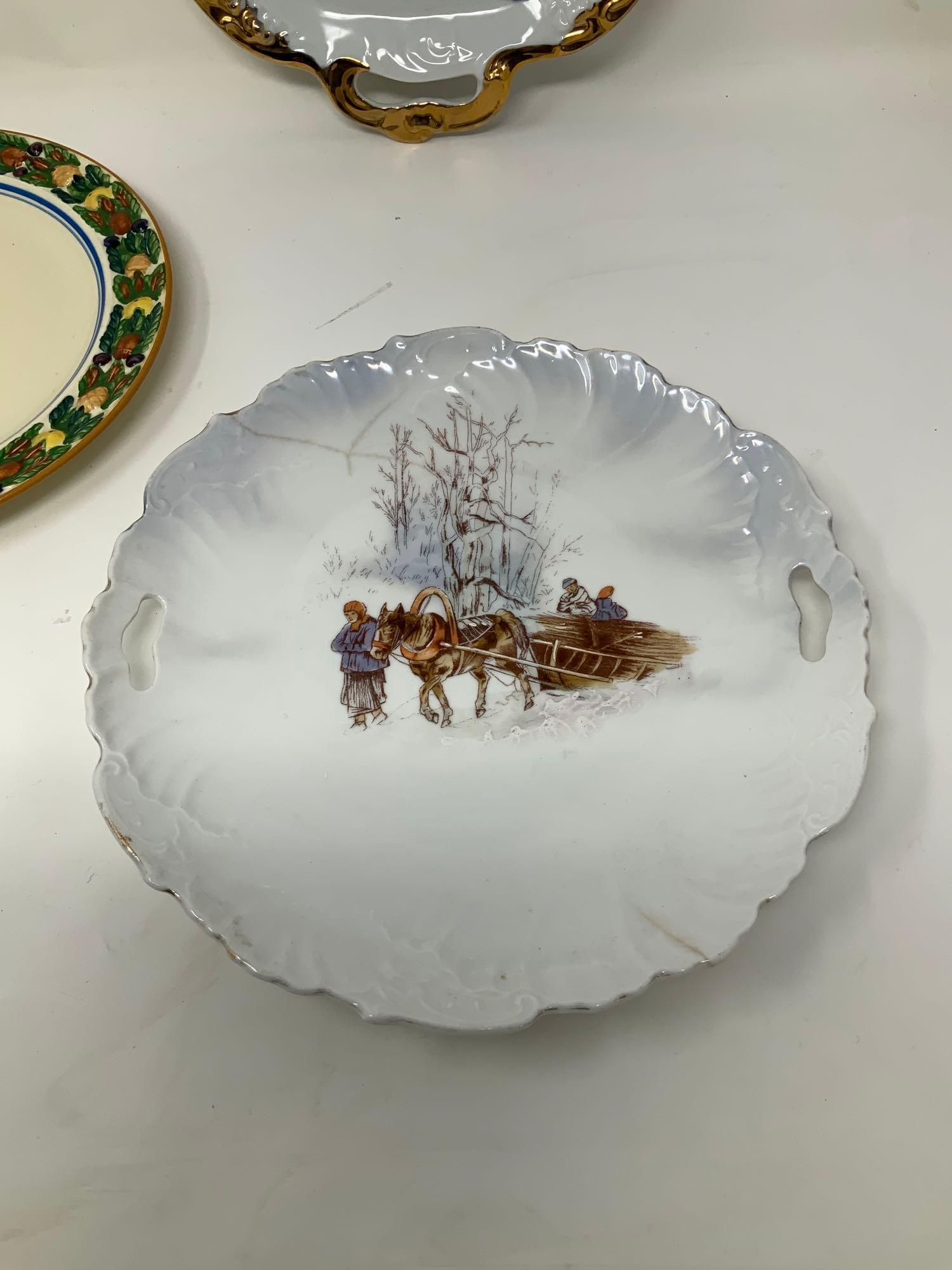 Four vintage decorated plates