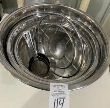 Set of metal mixing bowls and measuring cups