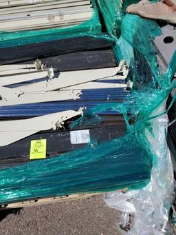 Pallet of kick plates and misc shelving pieces