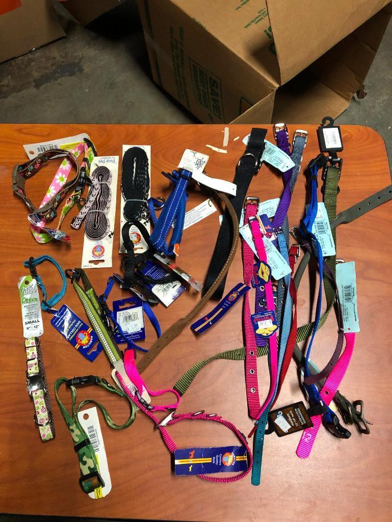 25, assorted leashes, collars, and harnesses