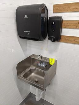 Stainless sink with paper towel and soap dispenser