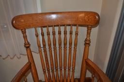 Antique rocking chair with cane bottom