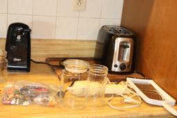 Contents of Counter including Coffee pot, toaster, cutting board etc.