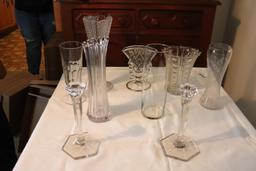 Large quantity of clear glass vases and candle holders