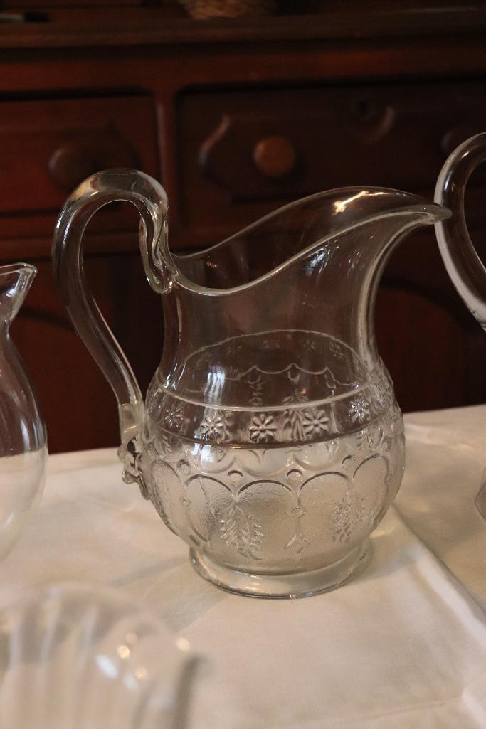 Quantity of clear glass pitchers