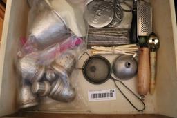 Contents of drawer including vintage kitchen utensils