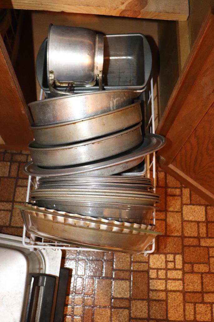 Contents of cabinets including pie pans, casserole dishes, Pyrex, etc.