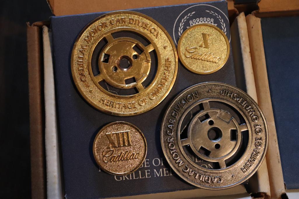 Various years of Cadillac wheel medallions