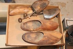 Vintage suitcase, wooden shoes, shoe stretchers, and wooden shelves