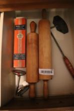 Contents of drawer including thermometer and rolling pins