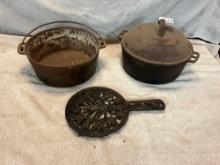 cast iron trivet, & (2) Dutch ovens, (1) lid missing