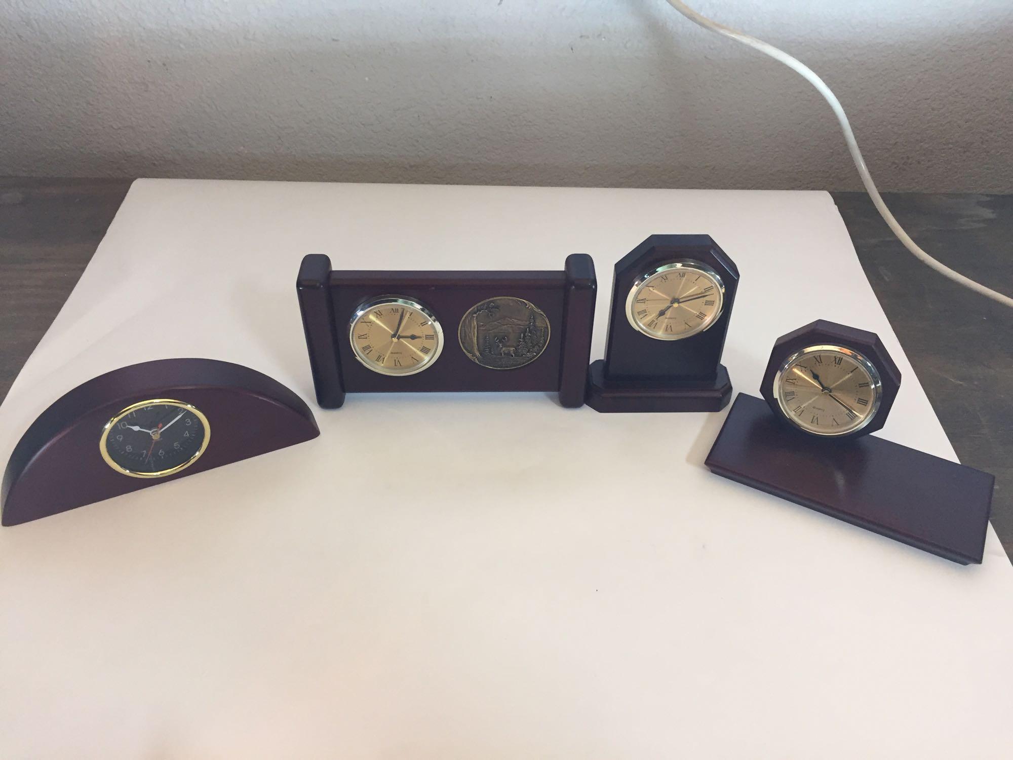 Lot of four mahogany desk clocks