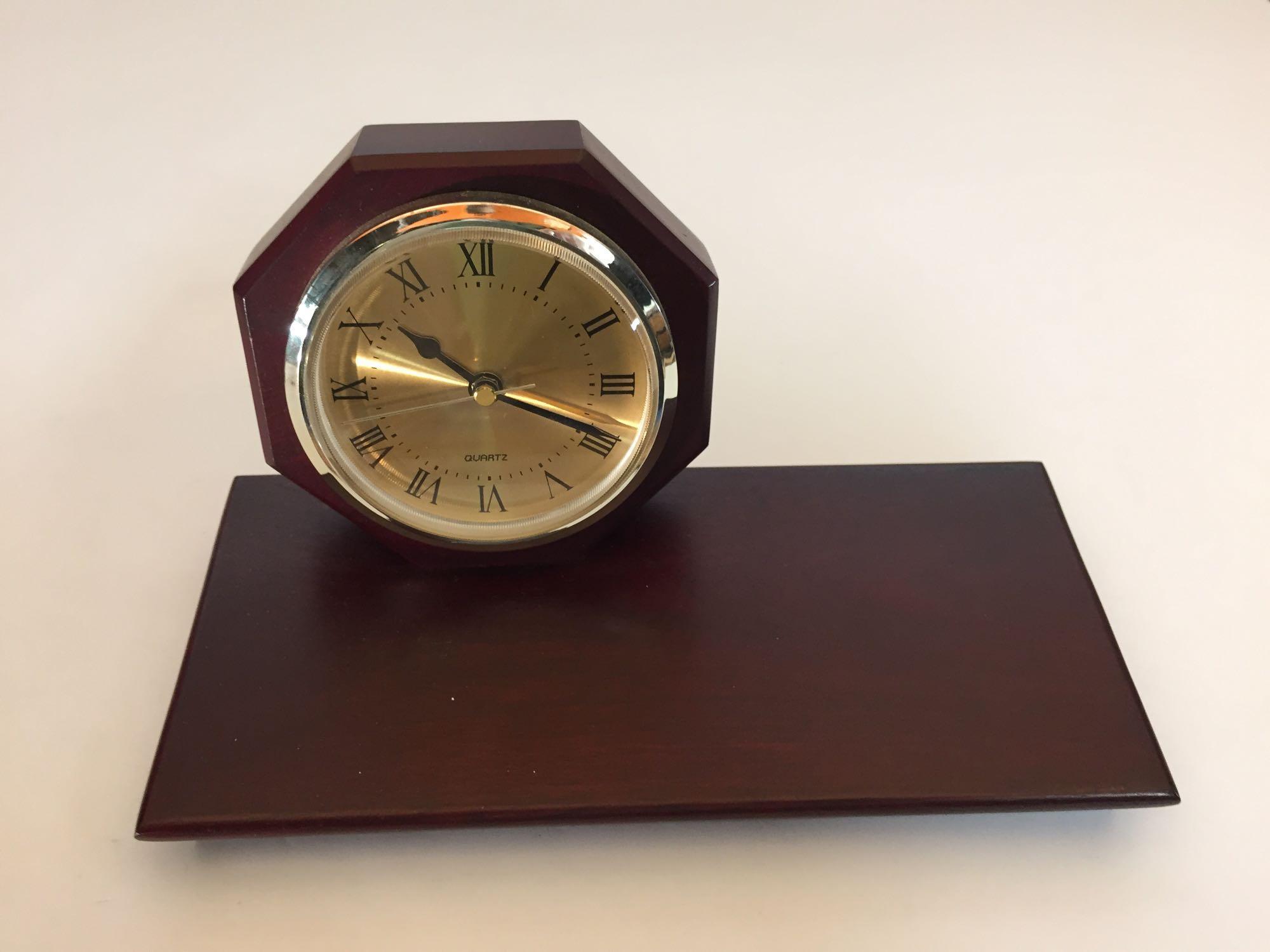 Lot of four mahogany desk clocks