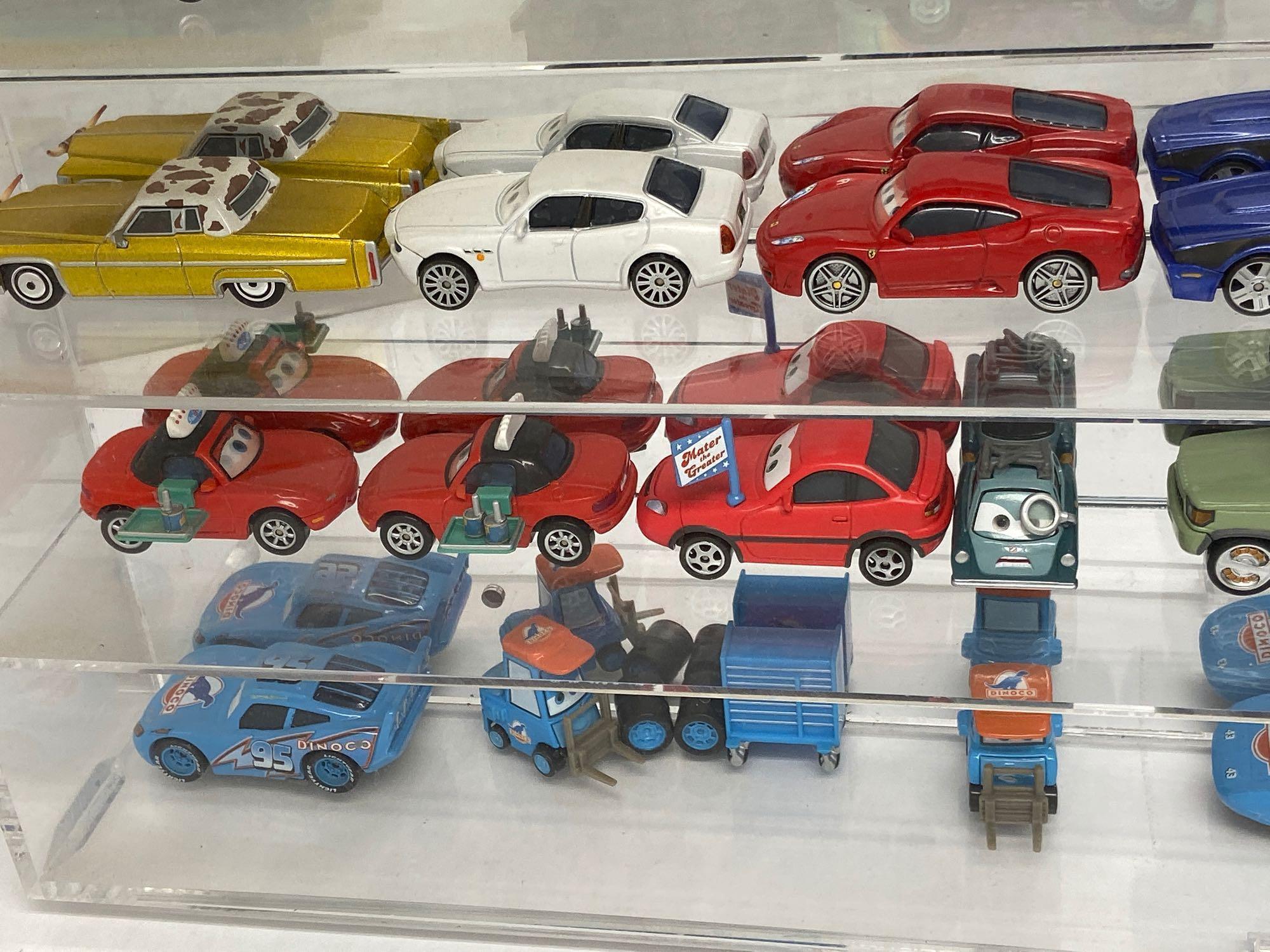 Pixar Cars Toys Collection in Mirrored Display Case 25x24in