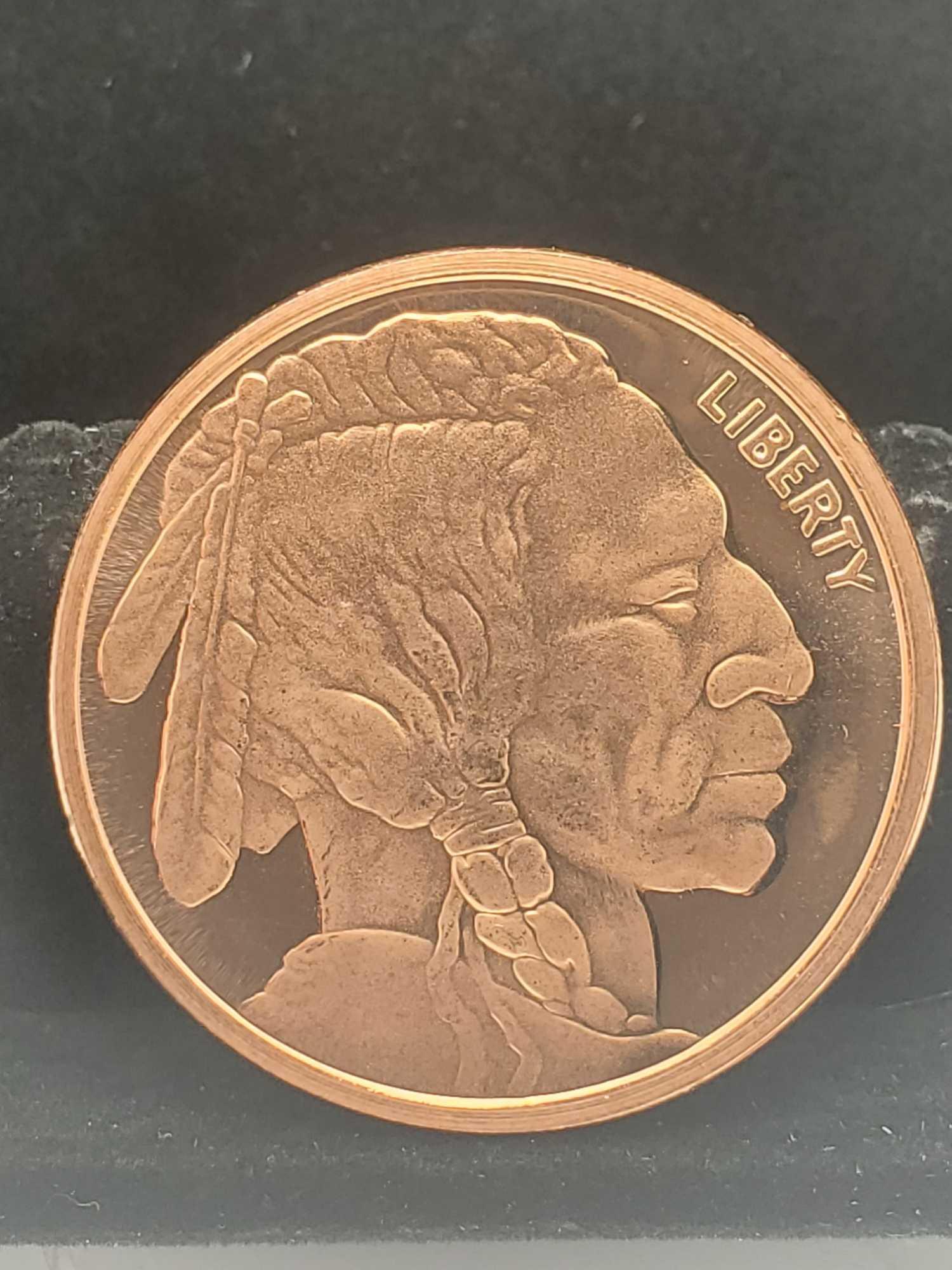 1 oz buffalo copper round and 2 silver 90% Washington quarters