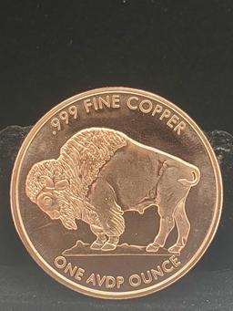 1 oz buffalo copper round and 2 silver 90% Washington quarters