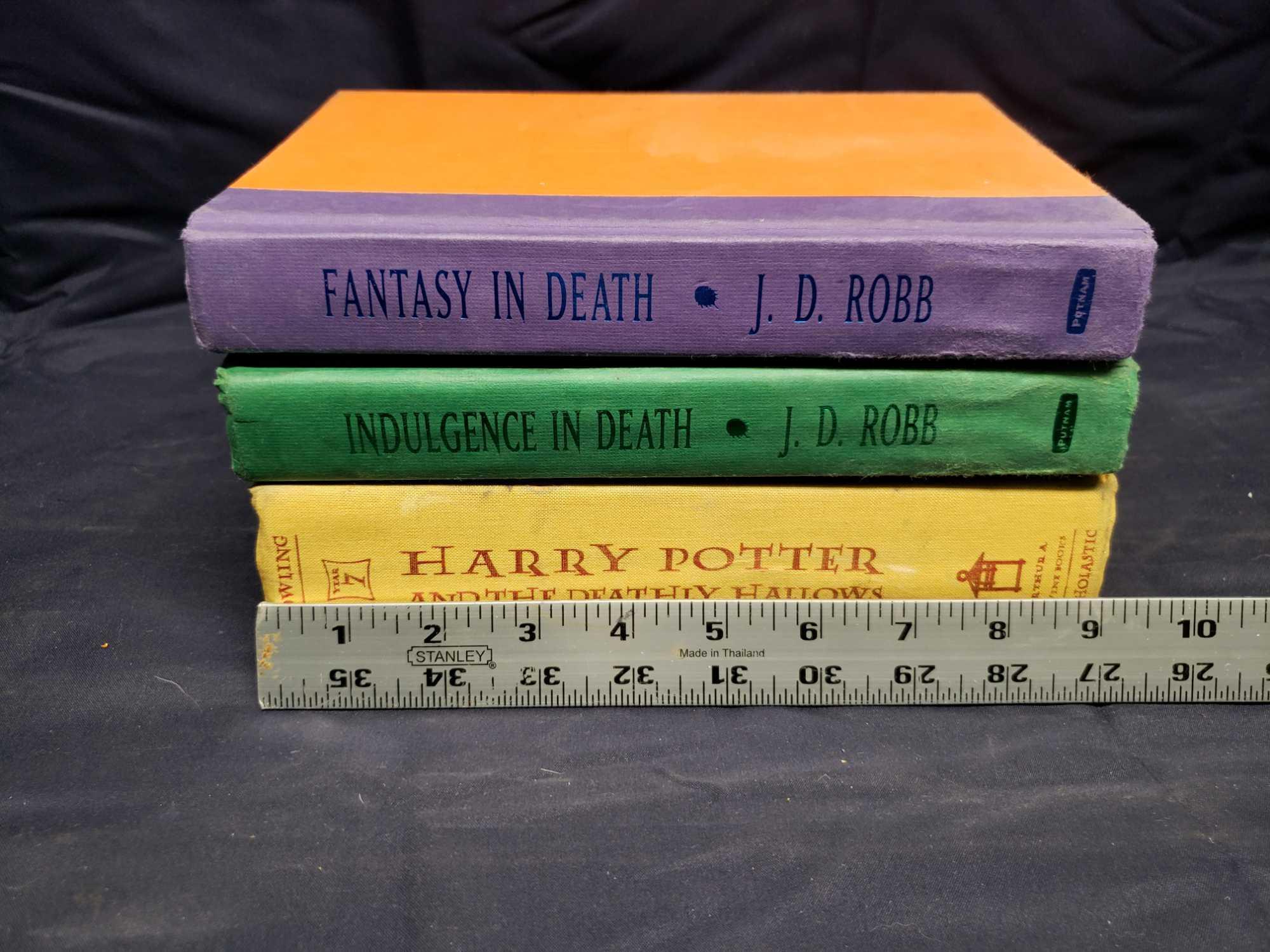 3 hard back books. Rowlings Harry Potter and the Deathly Hollows. JD RoBB Indulgence in Death and