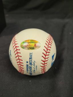 Autographed baseball says Reggie Jackson