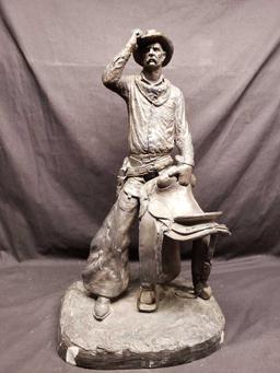 Statue says 1972 Michael Garman. Cowboy with saddle