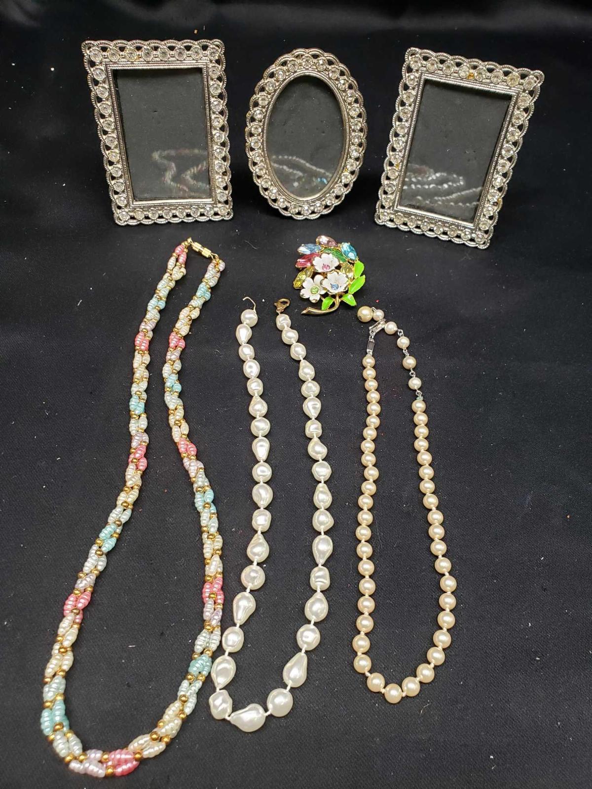 Trifari Pearls 2 other pearl style necklaces. Rhinestone Picture frames. Rhinestone pin.