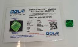 Emerald glowing green color with gem ID card square cut