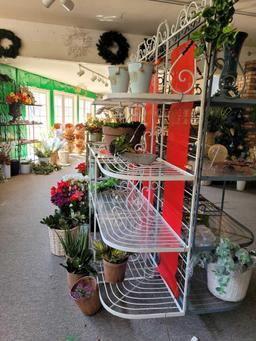 Multi tiered wrought iron display rack w plexiglass shelves. Pots and plants included