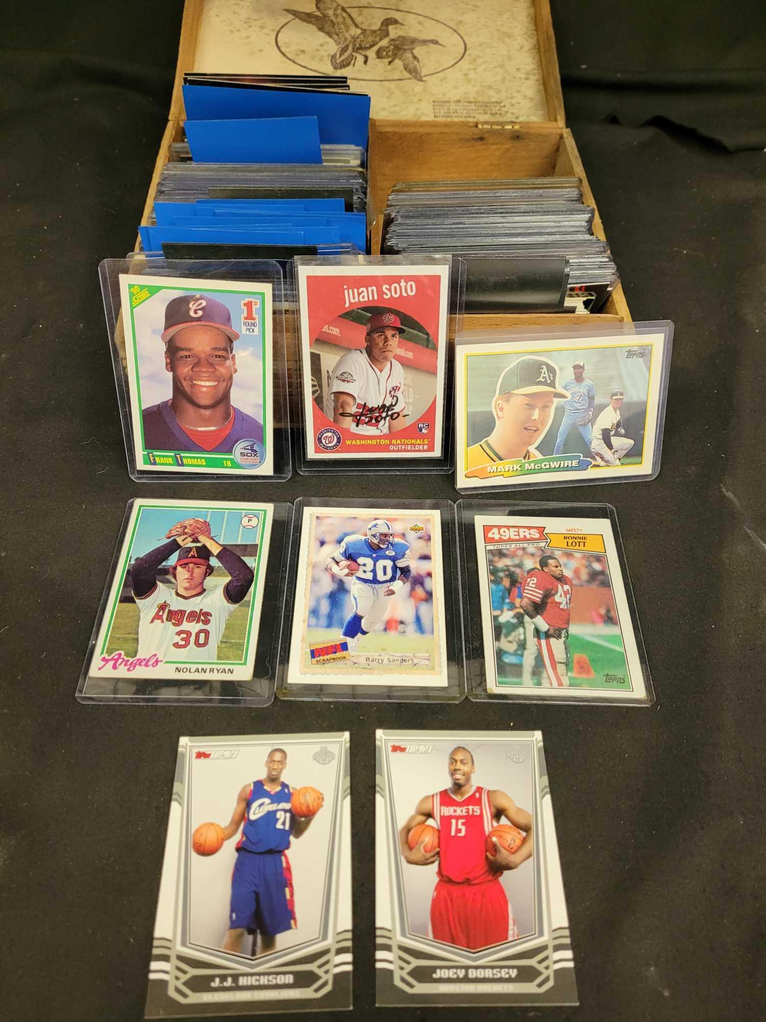 Box of baseball football and basketball ball cards