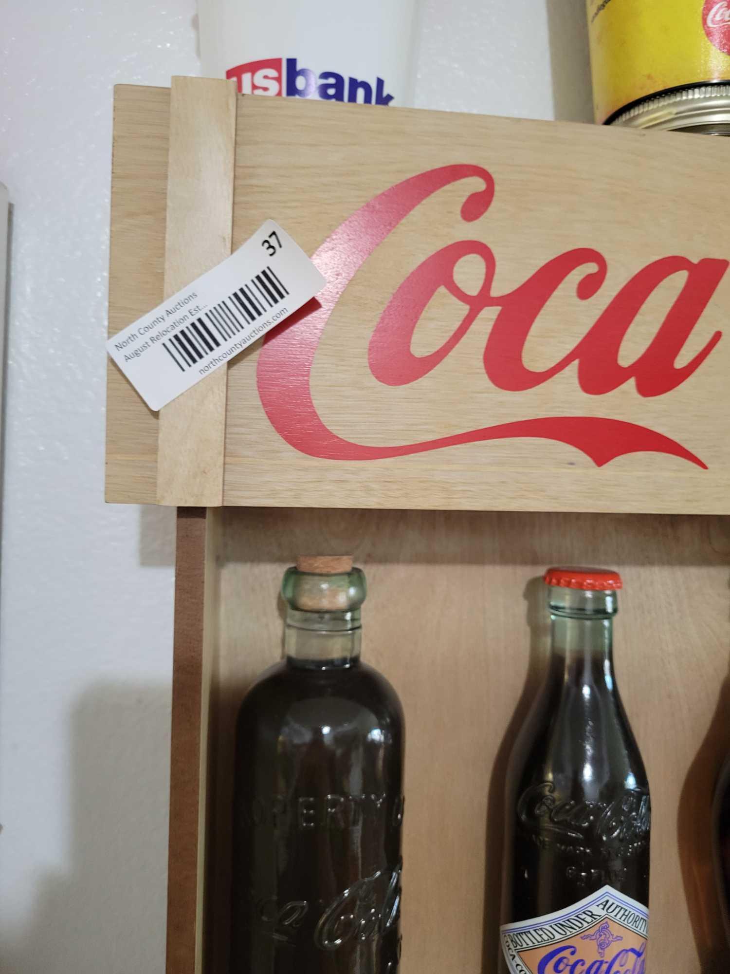 Vintage Coca Cola Bottles Display and Memorabilia