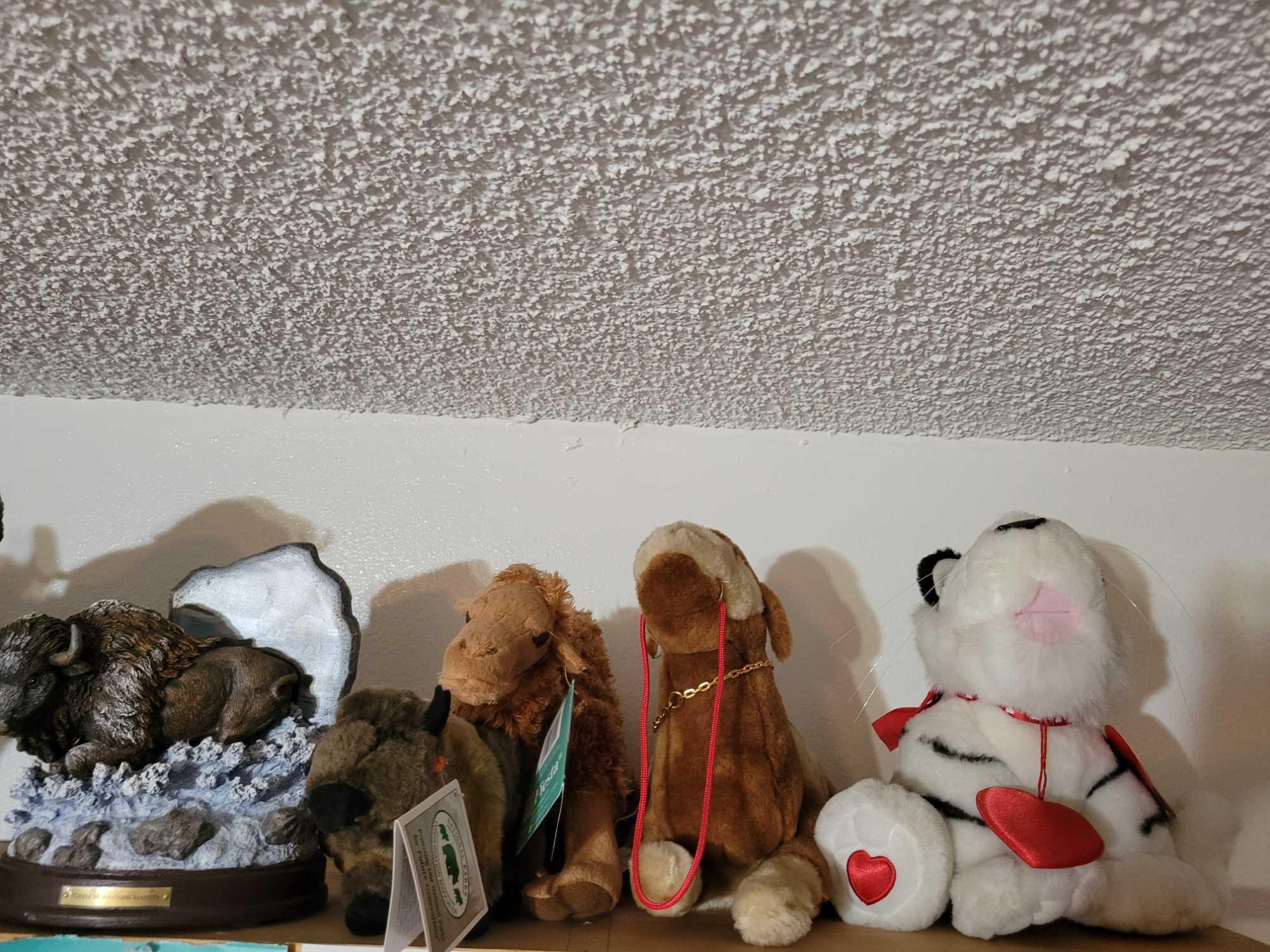 Stuffed animals. Buffalo statues Turtles pigs polar bears